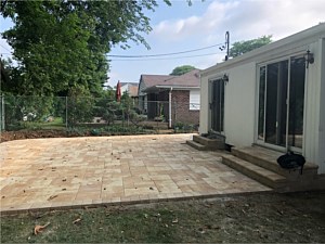 nicolock travertina alpine ridge patio with southgate wall steps out of sliding doors